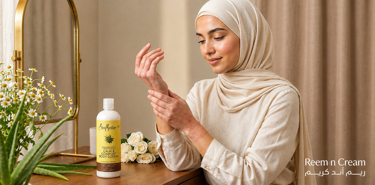 Woman in hijab applying body lotion beside a SheaMoisture bottle at a warm, elegant vanity.