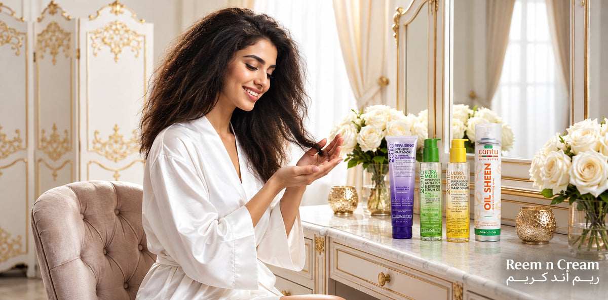 Luxury haircare products displayed at a vanity with a woman in a robe, white roses, and elegant decor for Reem n Cream.