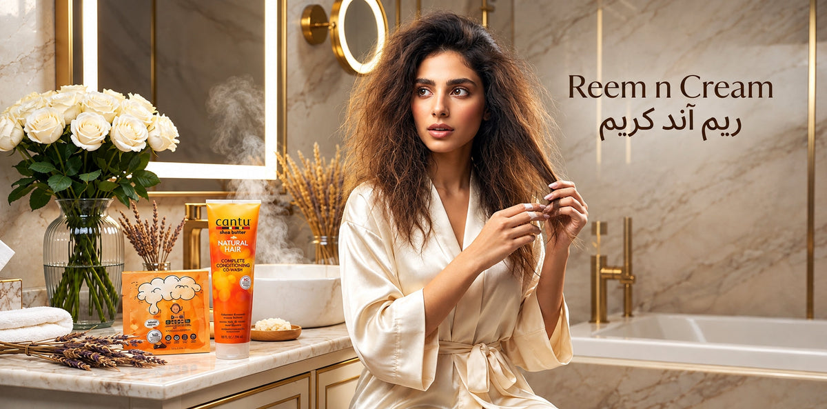 Reem n Cream beauty scene with Cantu hair products, roses, and woman styling her hair in a luxury bathroom.