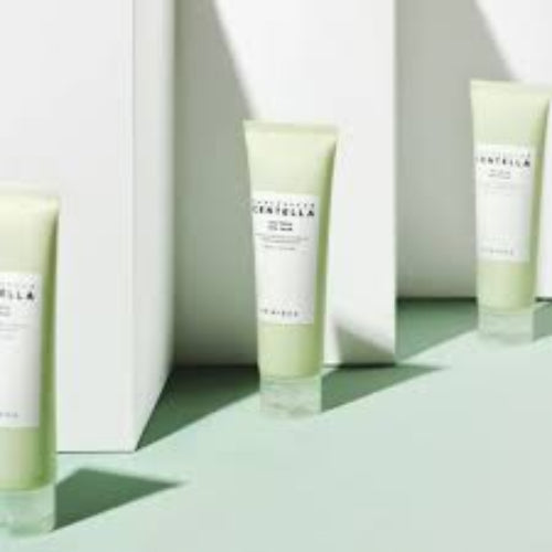 Multiple Madagascar Centella Tea-Trica BHA Foam cleanser tubes arranged on pastel green surface with geometric shadows and minimalist styling.