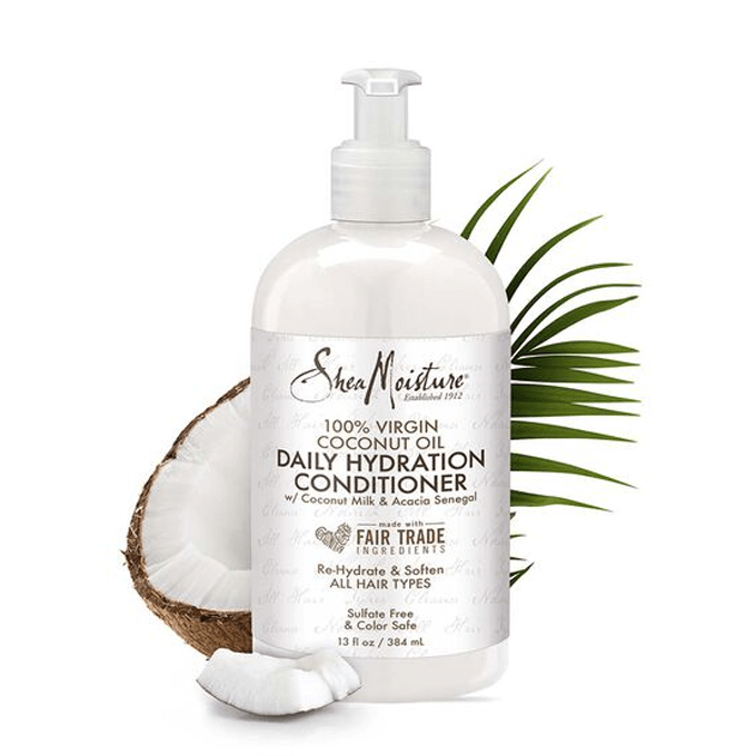 SheaMoisture coconut oil daily hydration conditioner bottle with a coconut and leaf on a white background